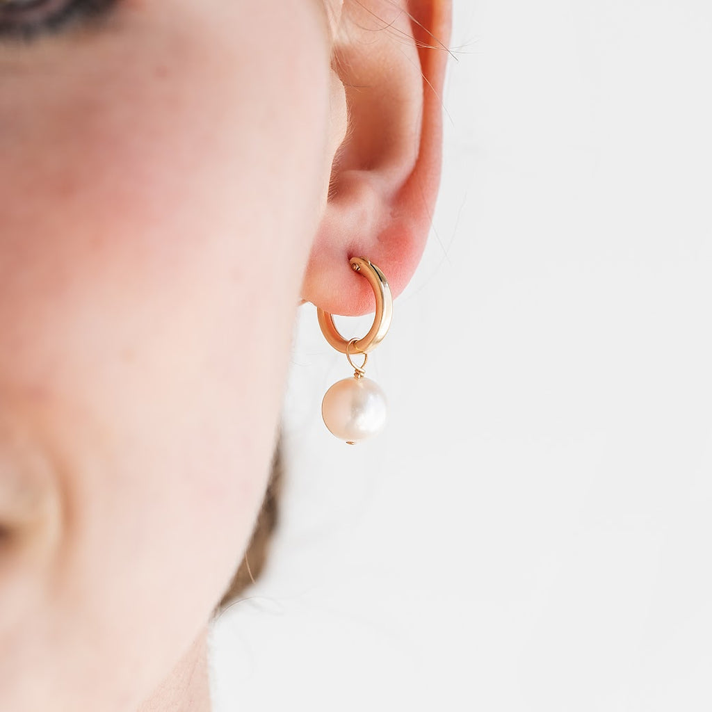 "Hestia" Baroque Pearl Hoop Earrings Stephanos' latest addition "Hestia" Baroque Pearl Hoop Earrings are the must have jewelry for this season.